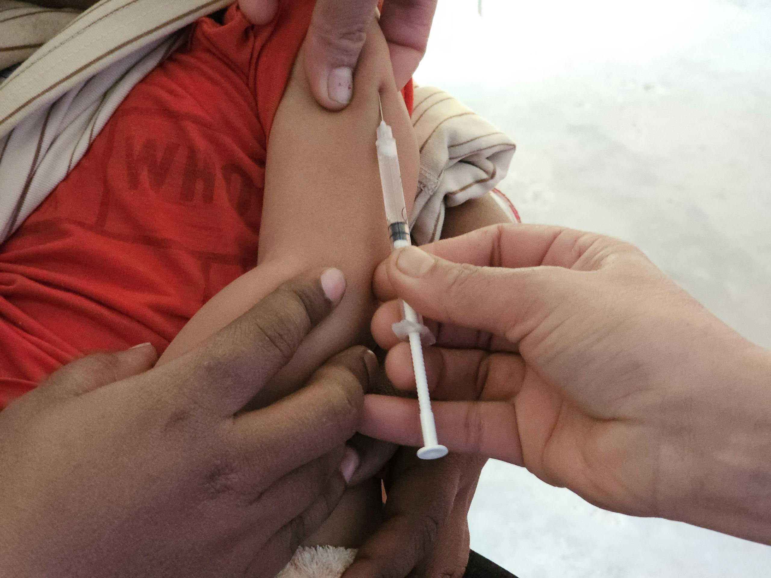 Arm of a Kid Getting Injected