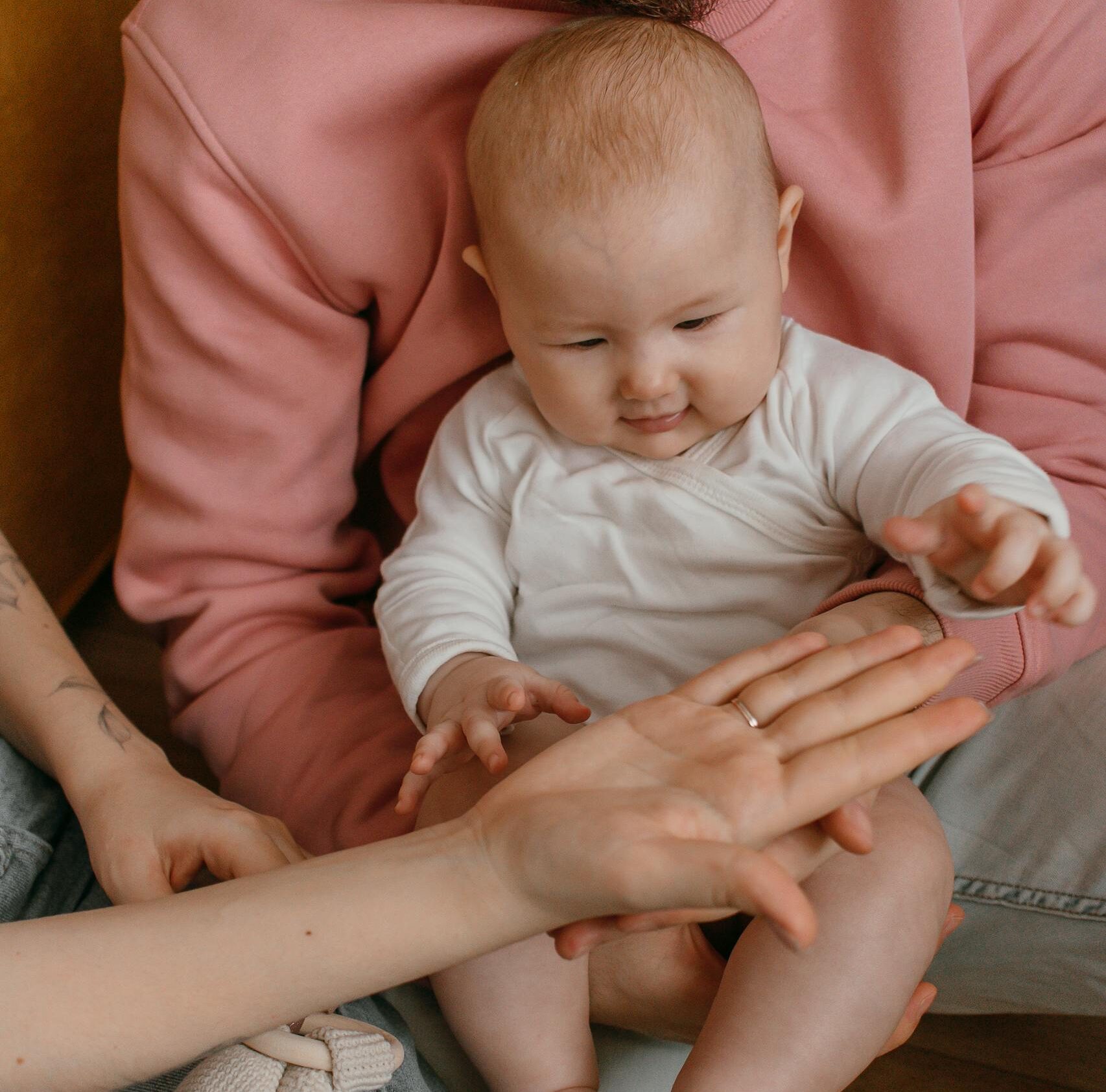 Couple Holding Their Child